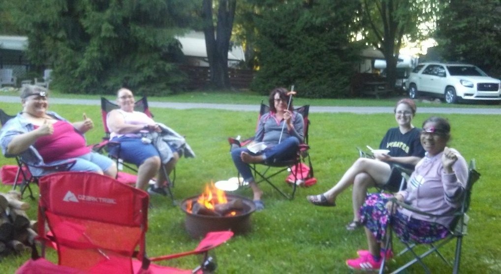Peoples Oakland members at a summer bonfire